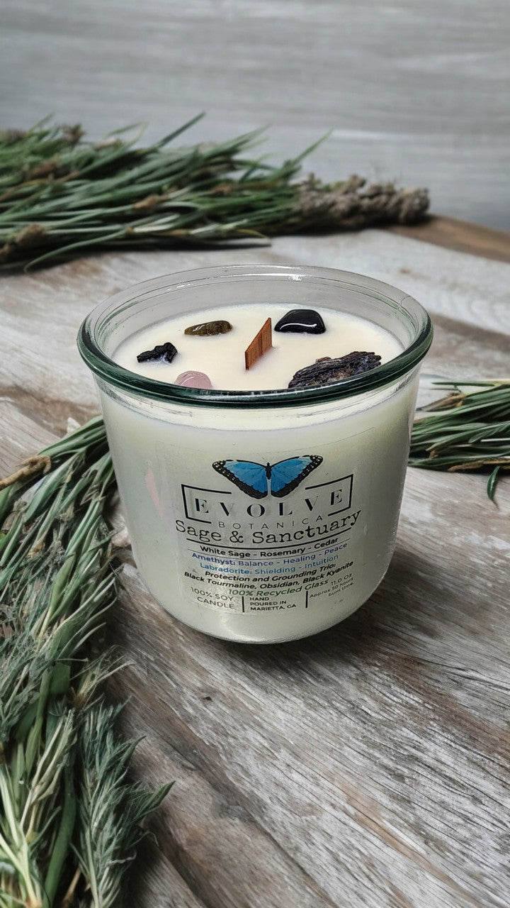 Rocks Candle by Evolve Botanica featuring sage, black kyanite, tourmaline, obsidian, amethyst, and labradorite gemstones.