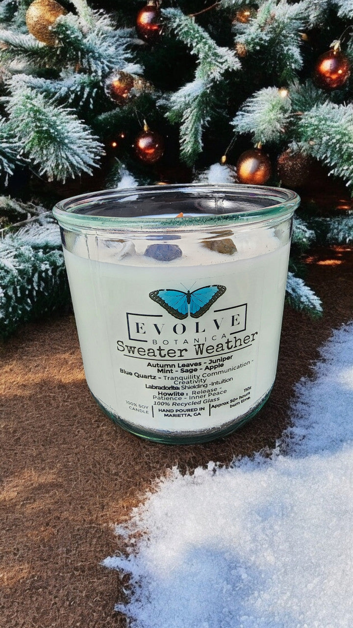 Evolve Botanica Rocks Candle Sweater Weather with wood wick, howlite, labradorite, and sodalite for patience, peace, shielding, and awareness.