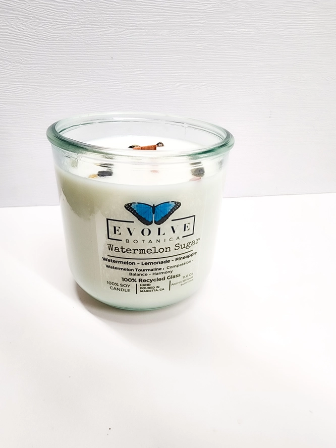 Evolve Botanica Watermelon Sugar Rocks Candle with wood wick, gemstone accents, soy wax, and vibrant watermelon scent.