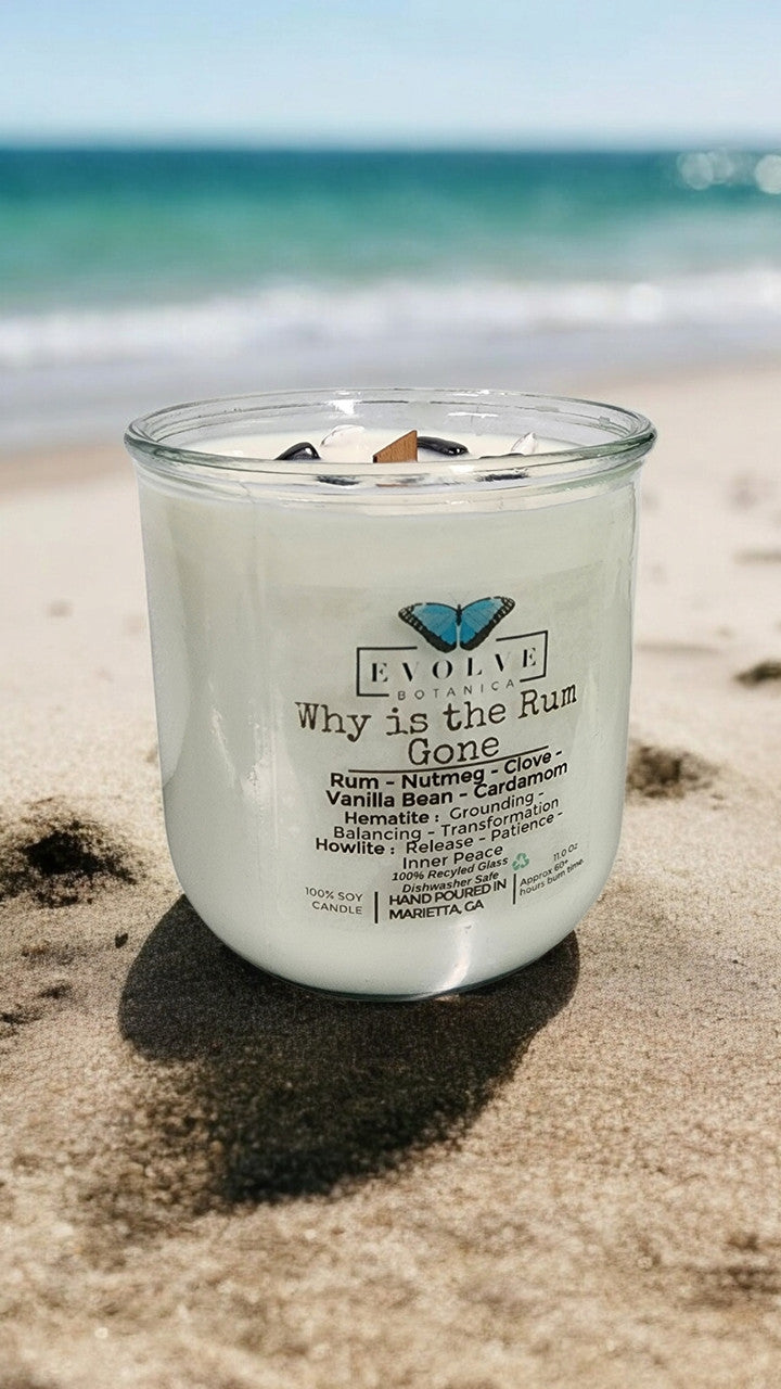 Evolve Botanica Rocks Candle with hematite and howlite stones, featuring a wood wick for grounding, balancing, and inner peace.