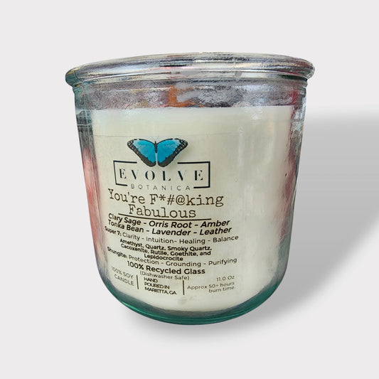Amethyst, quartz, smoky quartz, cacoxenite, rutile, goethite, and lepidocrocite Rocks Candle by Evolve Botanica with colorful mineral stones.