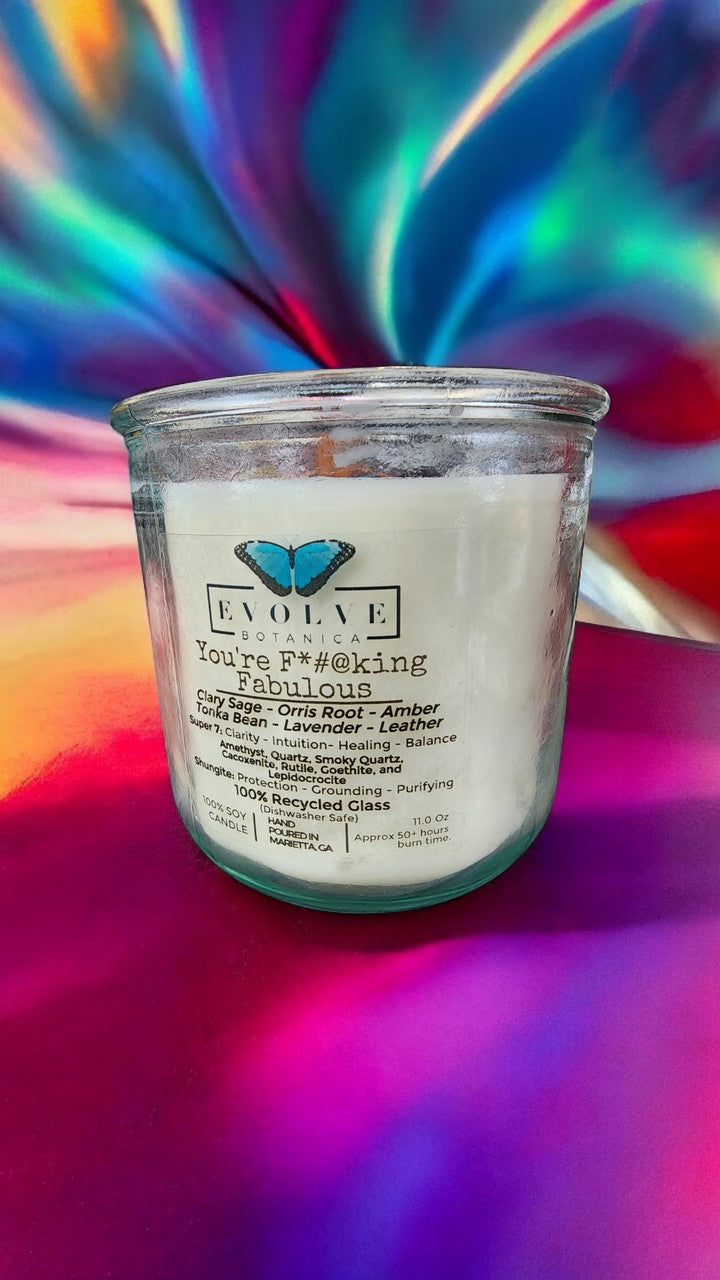 Evolve Botanica Rocks Candle featuring amethyst, quartz, smoky quartz, cacoxenite, rutile, goethite, and lepidocrocite crystals.