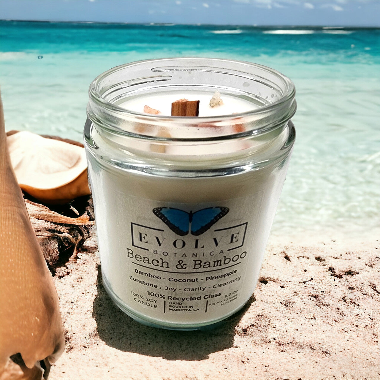 Evolve Botanica 9oz jam jar crystal soy candle with a natural wood wick, featuring beach and bamboo scent, Sunstone variant