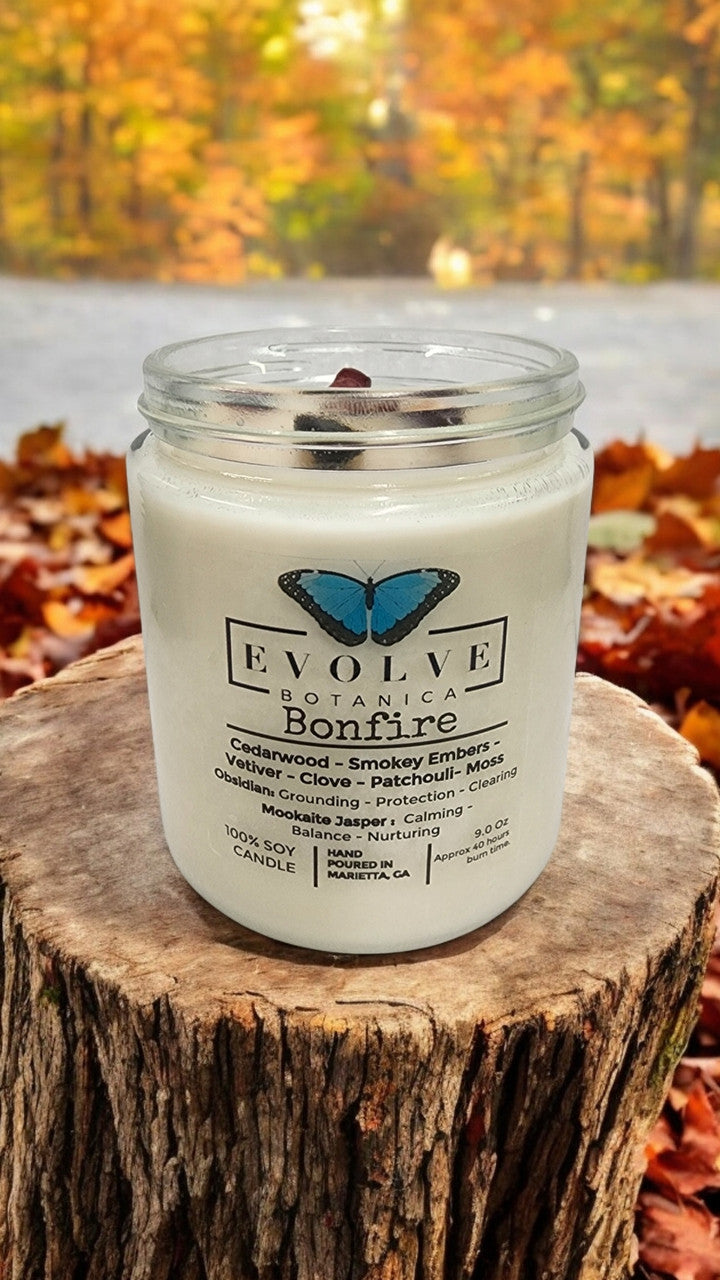 Classic 9oz Jam Jar crystal soy candle by Evolve Botanica featuring obsidian and mookaite stones with a natural wood wick and bonfire scent.