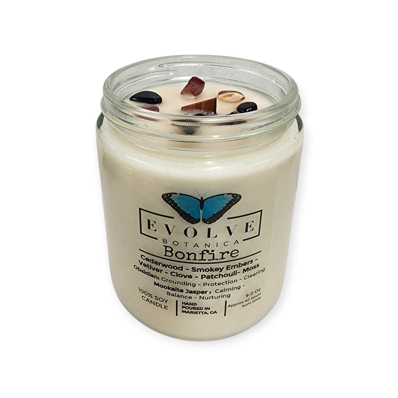 Classic 9oz Jam Jar soy candle by Evolve Botanica with obsidian and mookaite crystals, featuring a natural wood wick and bonfire scent.