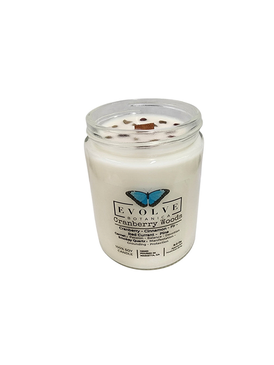 Evolve Botanica 9oz Jam Jar Crystal Soy Candle with cranberry woods scent, garnet, and smoky quartz accents on the natural wood wick