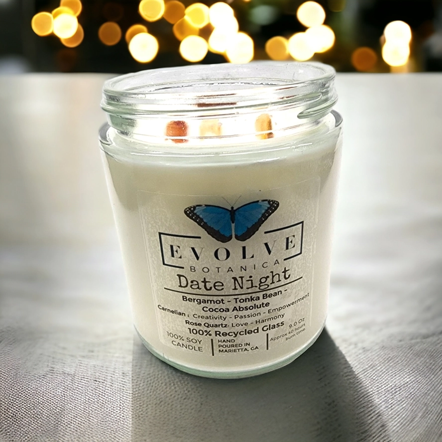 Evolve Botanica 9oz jam jar soy candle with natural wood wick, featuring rose quartz and carnelian crystals for date night ambiance