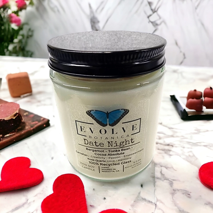 Evolve Botanica 9oz jam jar soy candle with rose quartz and carnelian crystals, natural wood wick, ideal for romantic date night ambiance.