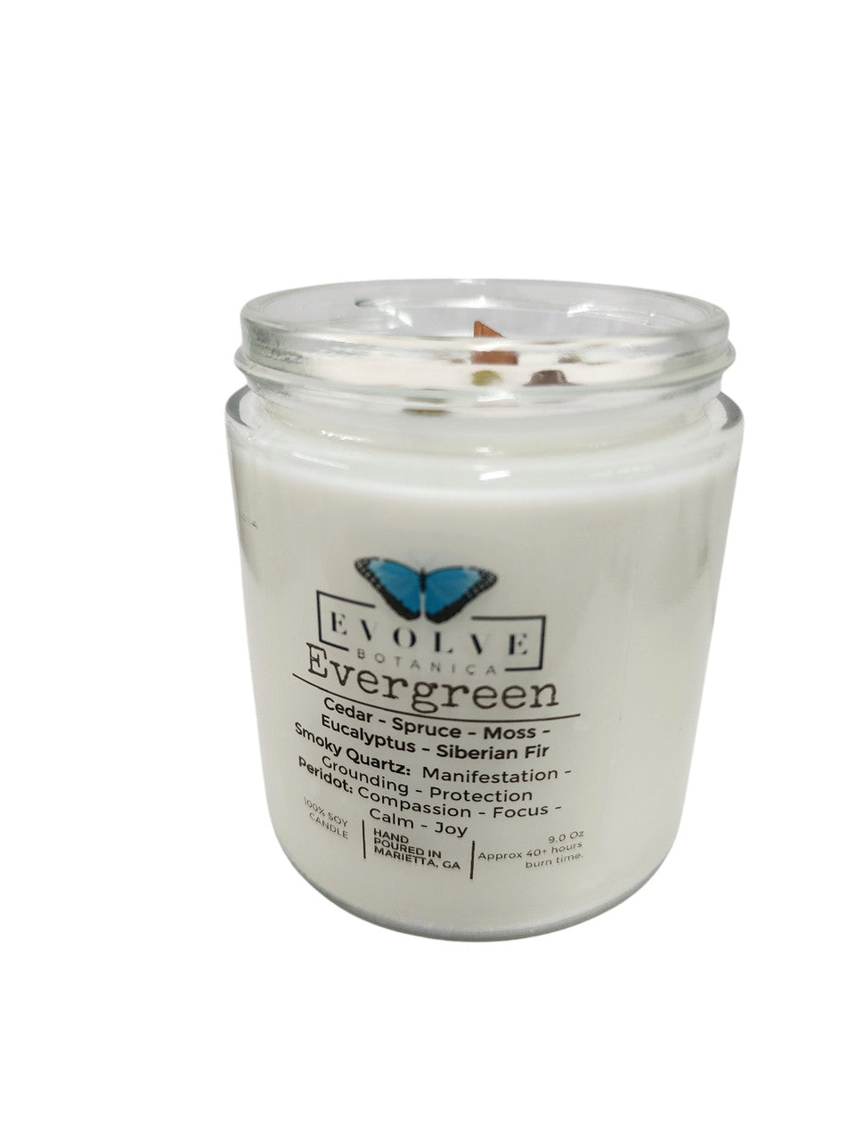 Evolve Botanica Classic 9oz jam jar soy candle with evergreen scent, smoky quartz and peridot crystals, natural wood wick.