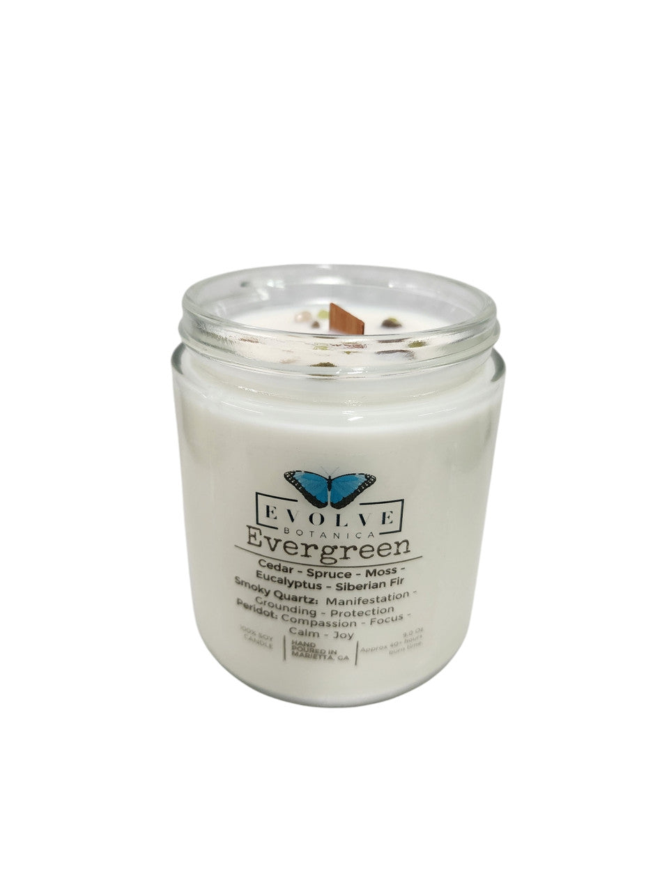 Evolve Botanica 9oz jam jar soy candle with evergreen scent, smoky quartz, and peridot crystals, natural wood wick.