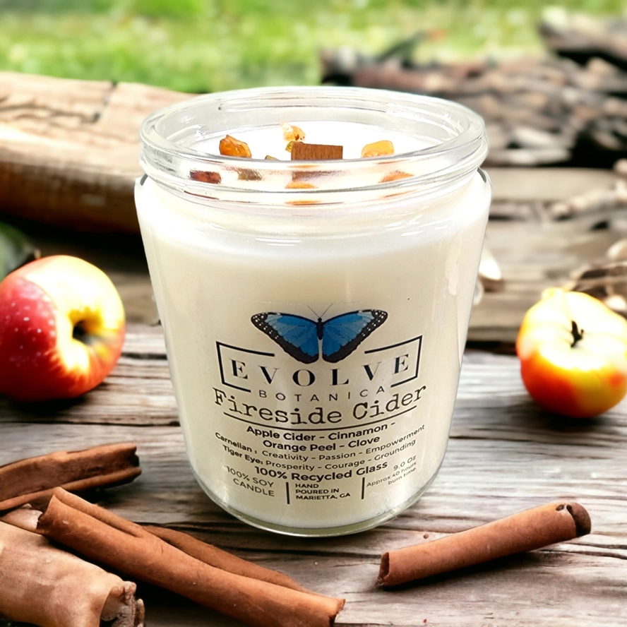 Evolve Botanica Classic 9oz Jam Jar Crystal Soy Candle with Carnelian and Tigers Eye stones, featuring natural wood wick and Fireside Cider scent.