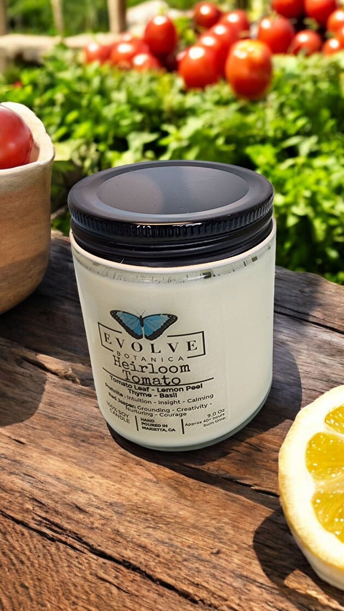 Evolve Botanica 9oz jam jar soy candle with heirloom tomato scent, crystal prehnite, and red jasper stones, natural wood wick.