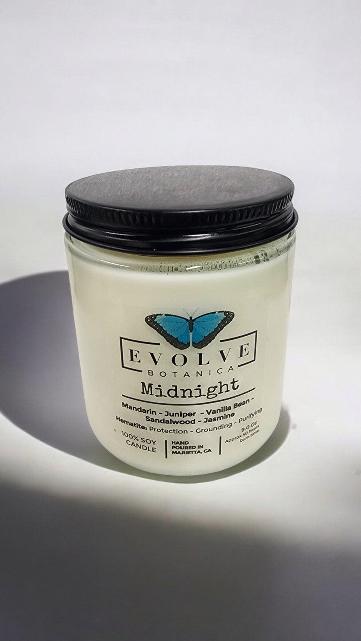 Evolve Botanica Classic 9oz Jam Jar Crystal Soy Candle Midnight Super Seven with natural wood wick, crafted for a cozy ambiance.
