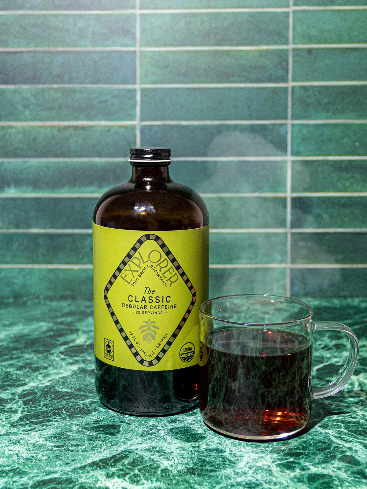 32oz Explorer Cold Brew coffee concentrate bottle, featuring a sleek label and clear packaging for cold brew preparation.