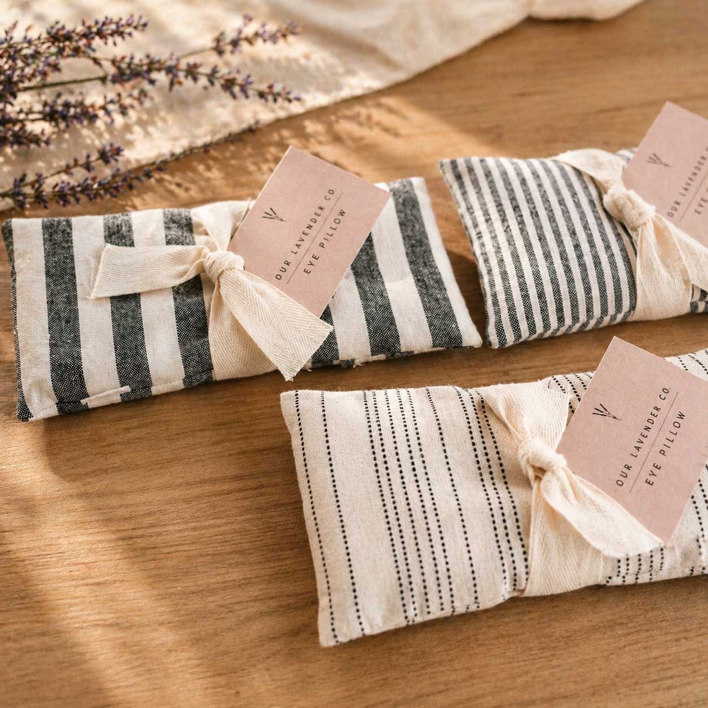 Lavender eye pillow from Our Lavender Co with fabric cover, designed for heating or cooling relaxation in bath and body care.