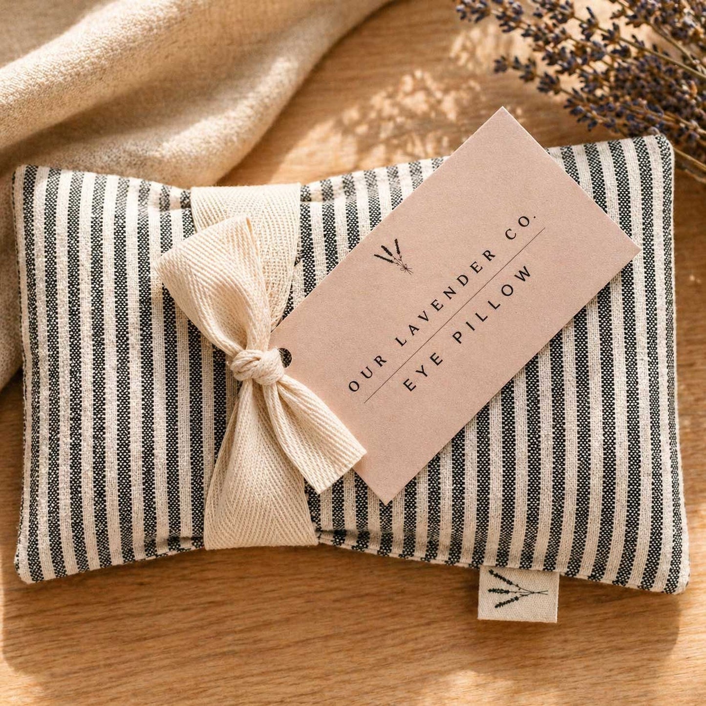 Lavender eye pillow from Our Lavender Co, heating and cooling pad with soft fabric, ideal for relaxation and stress relief.