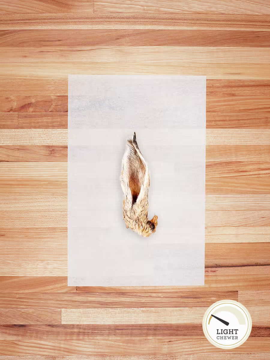 Farm Hounds hairy rabbit chews and hides, natural dog treats with textured hair, shown from the front side.