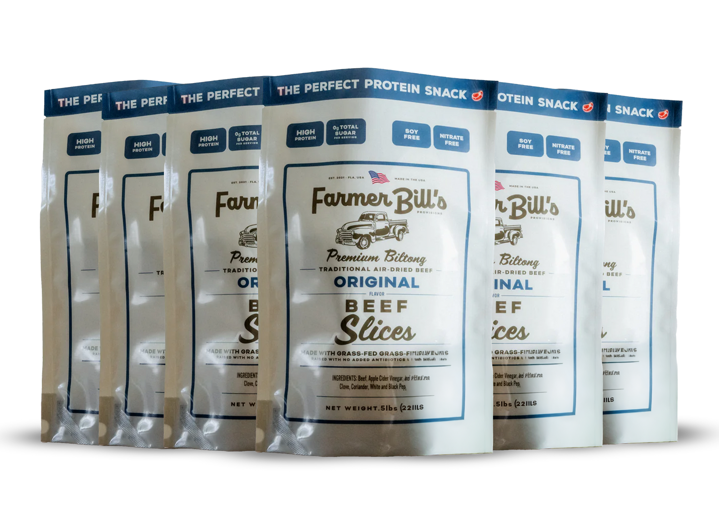 Six packs of Farmer Bill’s Provisions 1/2 lb Sliced Original Beef Biltong, made from South Dakota regenerative grass-fed beef, are lined up. The white-and-blue packaging promotes high protein and no nitrates.