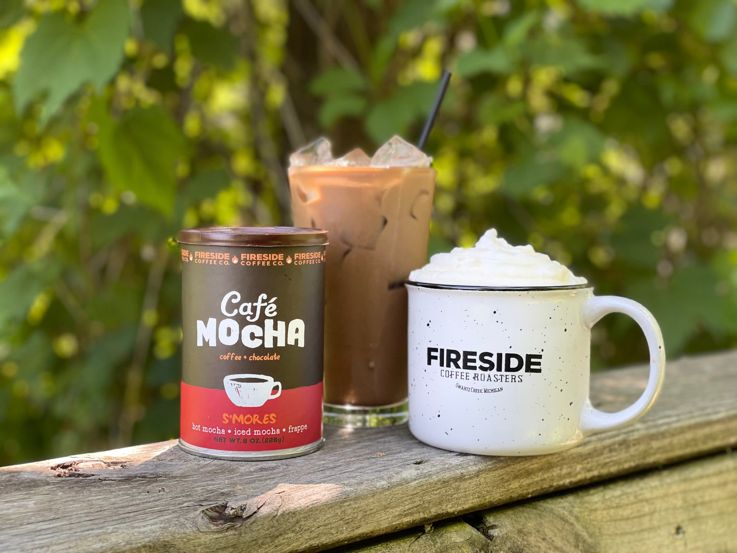 Fireside Coffee Co. S'mores Cafe Mocha in a mug with whipped cream, chocolate drizzle, and graham cracker crumbs on top.