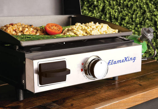 Flame King portable propane cast iron flat-top grill and griddle for camping, with a sturdy cooking surface and compact design.