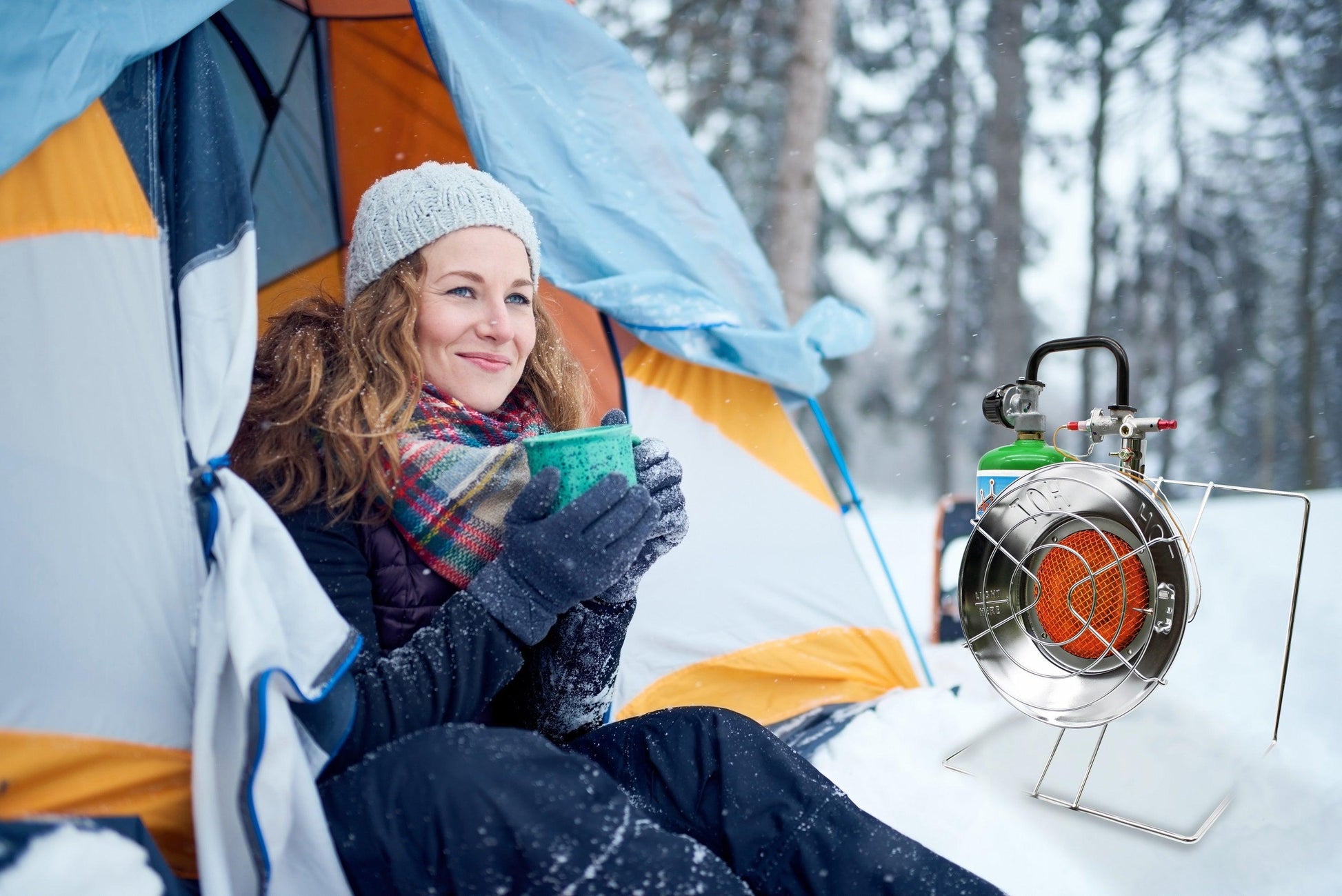 Portable Flame King burner and heater for camping, featuring a compact design with control knobs and sturdy base.
