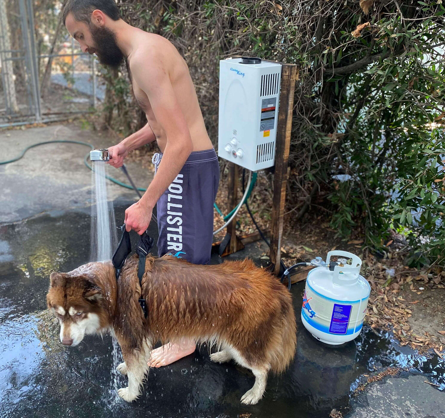 Flame King tankless outdoor camping hot shower water heater, propane gas-powered, 10L capacity, 68,000 BTU, for RV and trailer use.