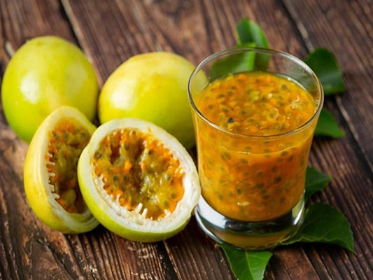 Yellow passion fruit from Florida Plants Nursery, ripe yellow passion fruit with vibrant skin and tropical appearance.