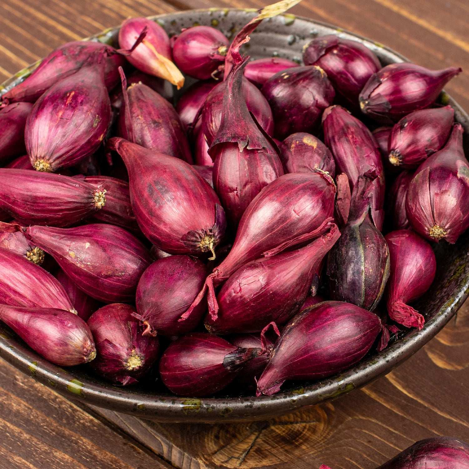 Red Onion Sets in Red Baron variety from Fresh Garden Living, showing 50-60 non-GMO onion bulbs ready for planting.