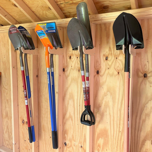 Garden tool organizer rack by HangThis Up, outdoor shed storage for yard tools, keeps tools neat and accessible in the shed.