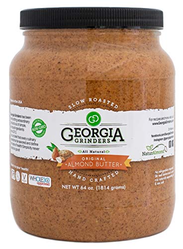 The Georgia Grinders 64 oz Bulk Tub Original Almond Butter features a black lid, green and brown-accented label, and is all natural, hand crafted, non-GMO, Whole30 Approved, with slow roasted almonds.
