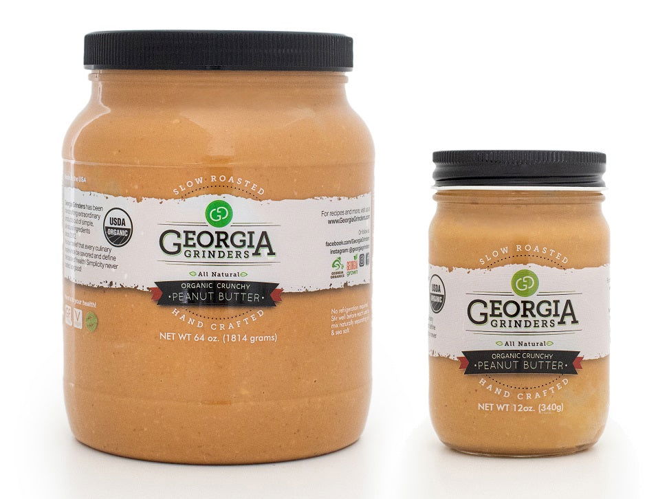 One large 64oz tub and one small 12oz jar of Georgia Grinders organic crunchy peanut butter, both USDA Organic Certified and featuring white labels with brand and product details.