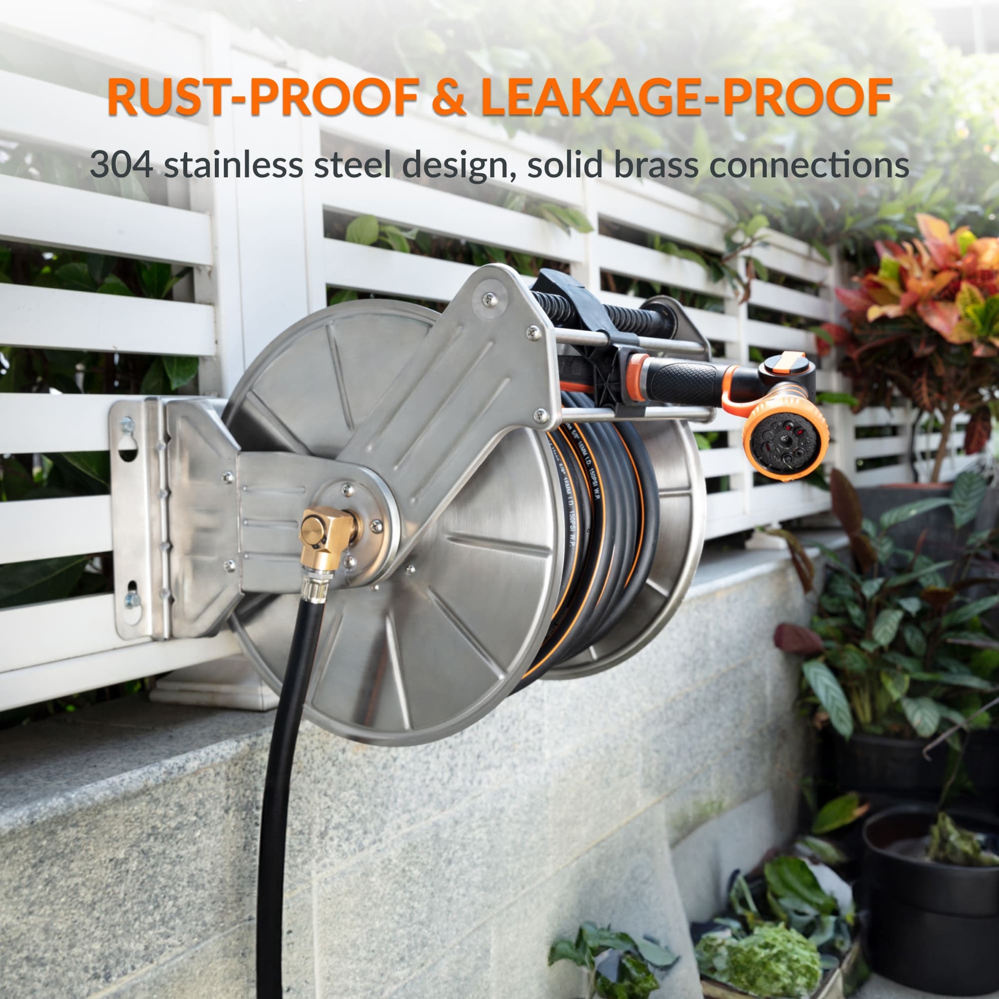 Stainless steel wall-mounted manual crank garden hose reel by Giraffe Tools US, heavy-duty design with visible crank handle.