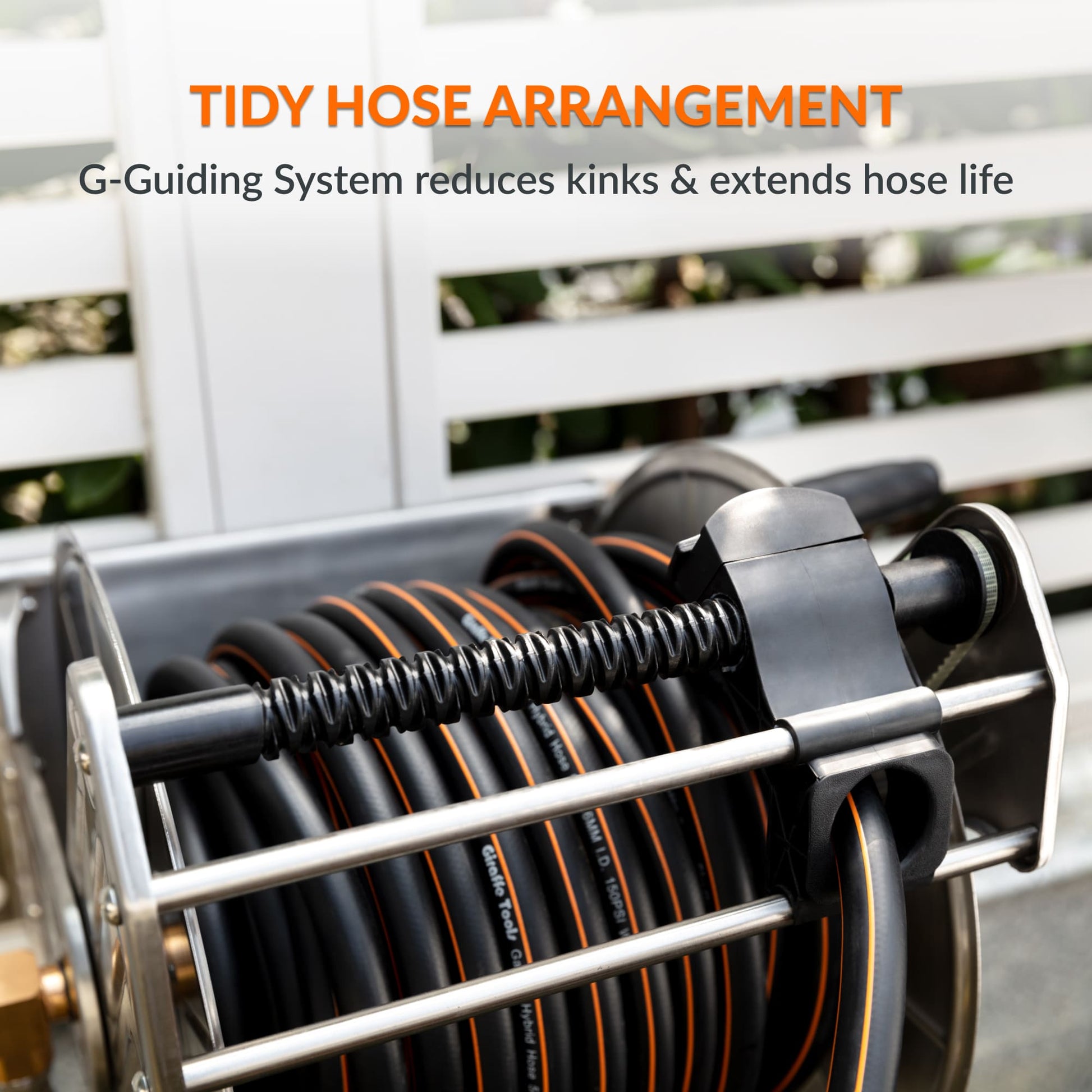 Stainless steel wall-mounted manual crank garden hose reel by Giraffe Tools US, heavy-duty design for outdoor watering.