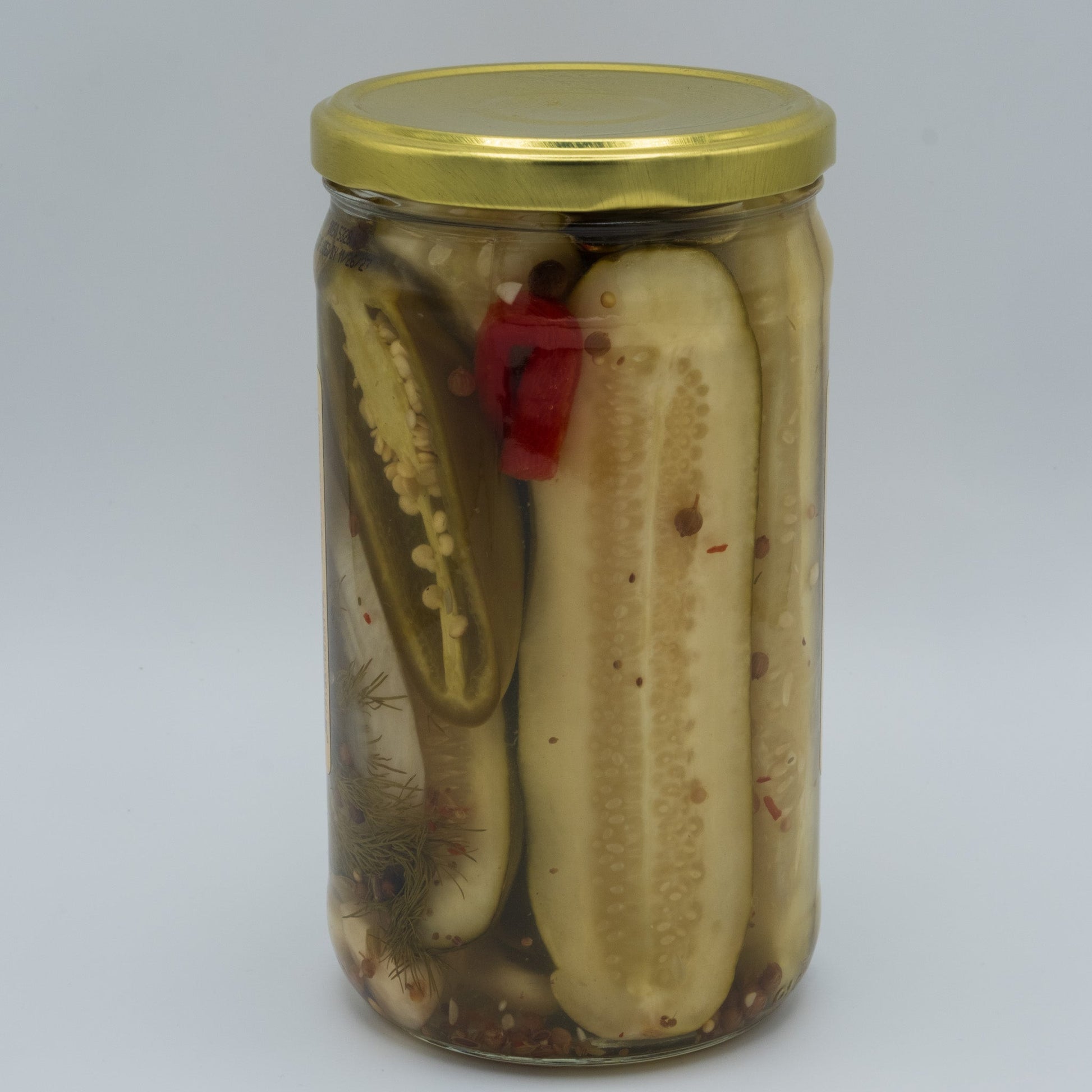 Canned Granny's Hot Sweet Pickles in 24oz jar by Amish Country Store, showing bright, spicy pickles inside clear glass.