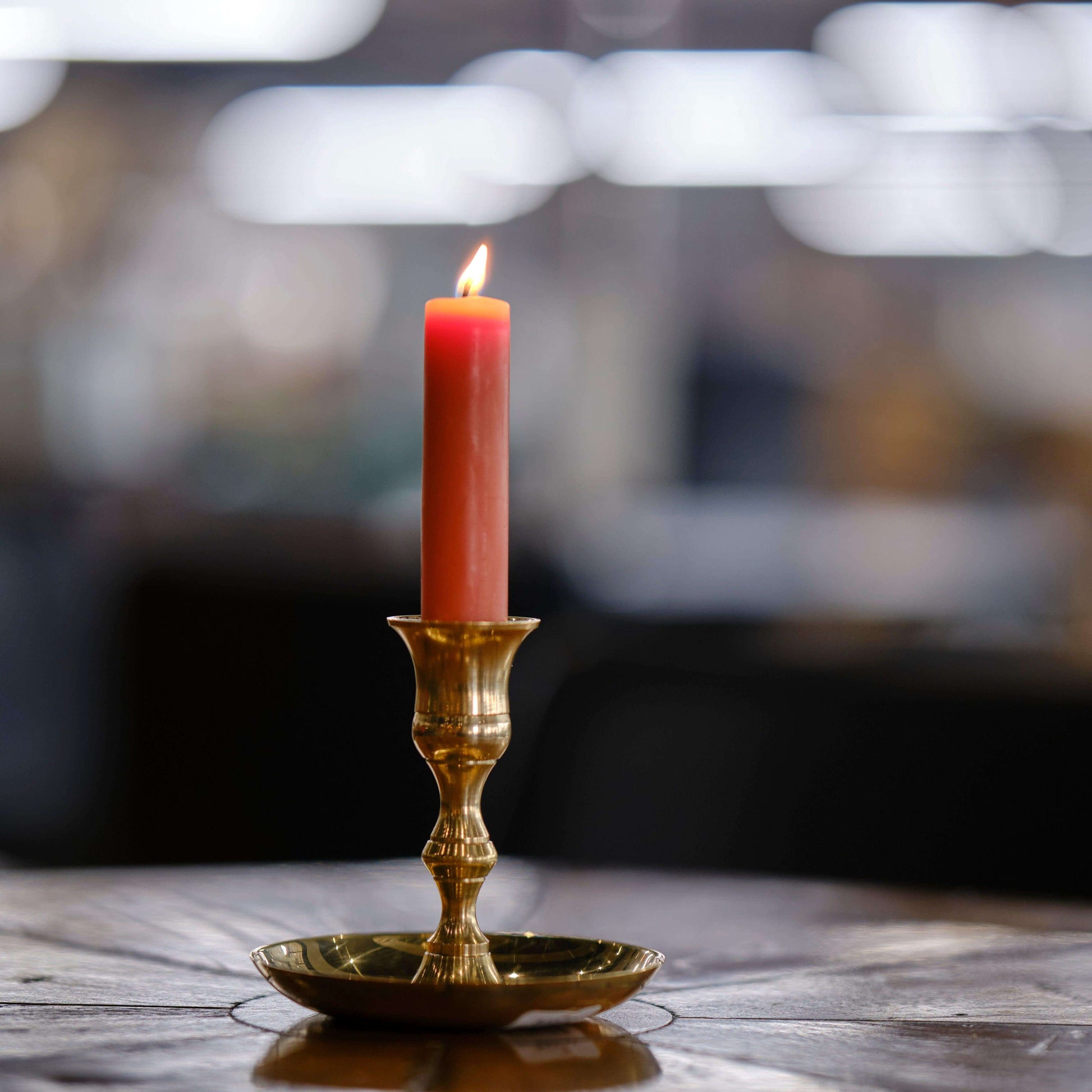 Hand-dipped beeswax taper candles in a bulk 4-pair bundle by Bluecorn Candles, showcasing natural beeswax texture and warm color.