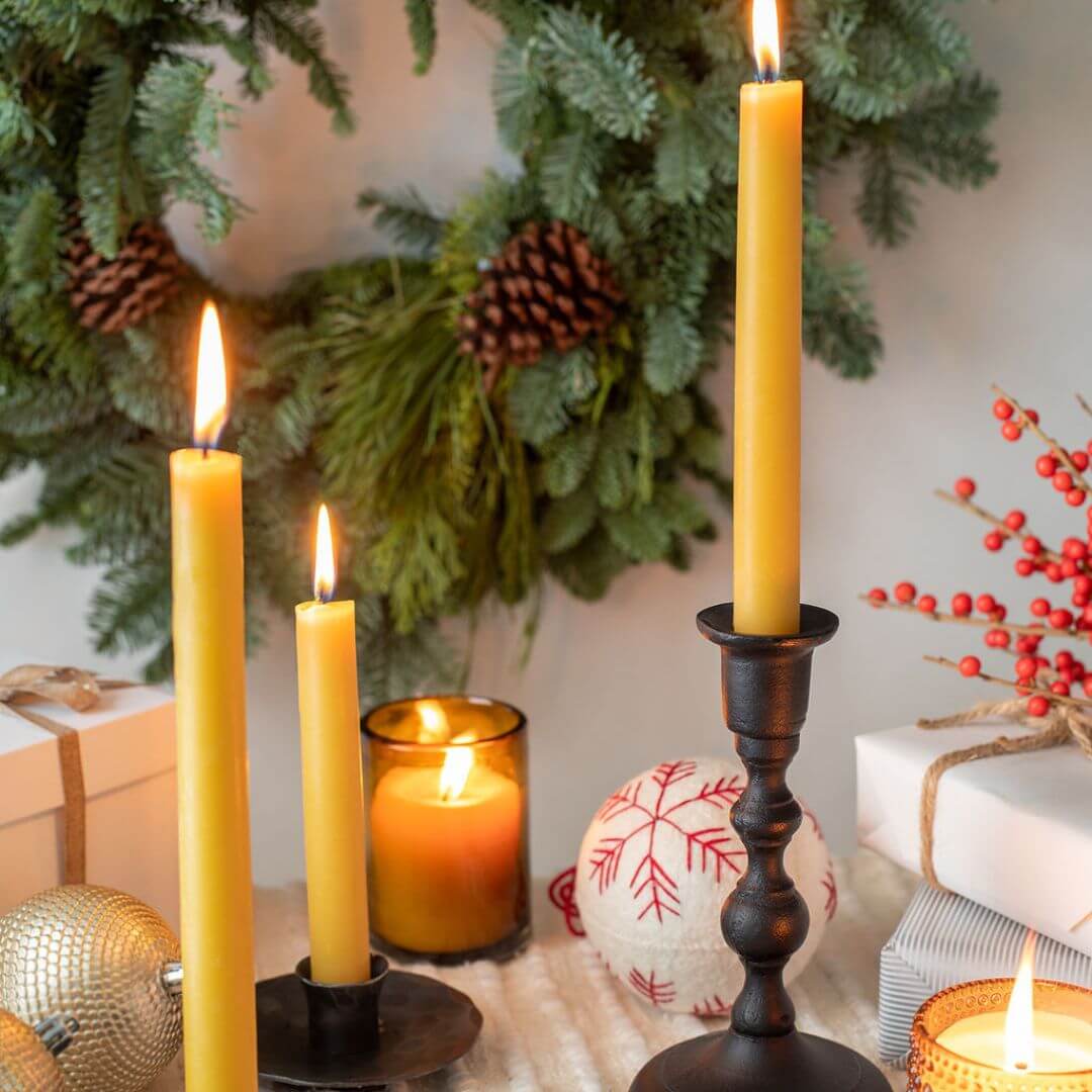 Hand-dipped beeswax taper candles in a bulk 4-pair bundle by Bluecorn Candles, featuring warm natural tones and handcrafted details.