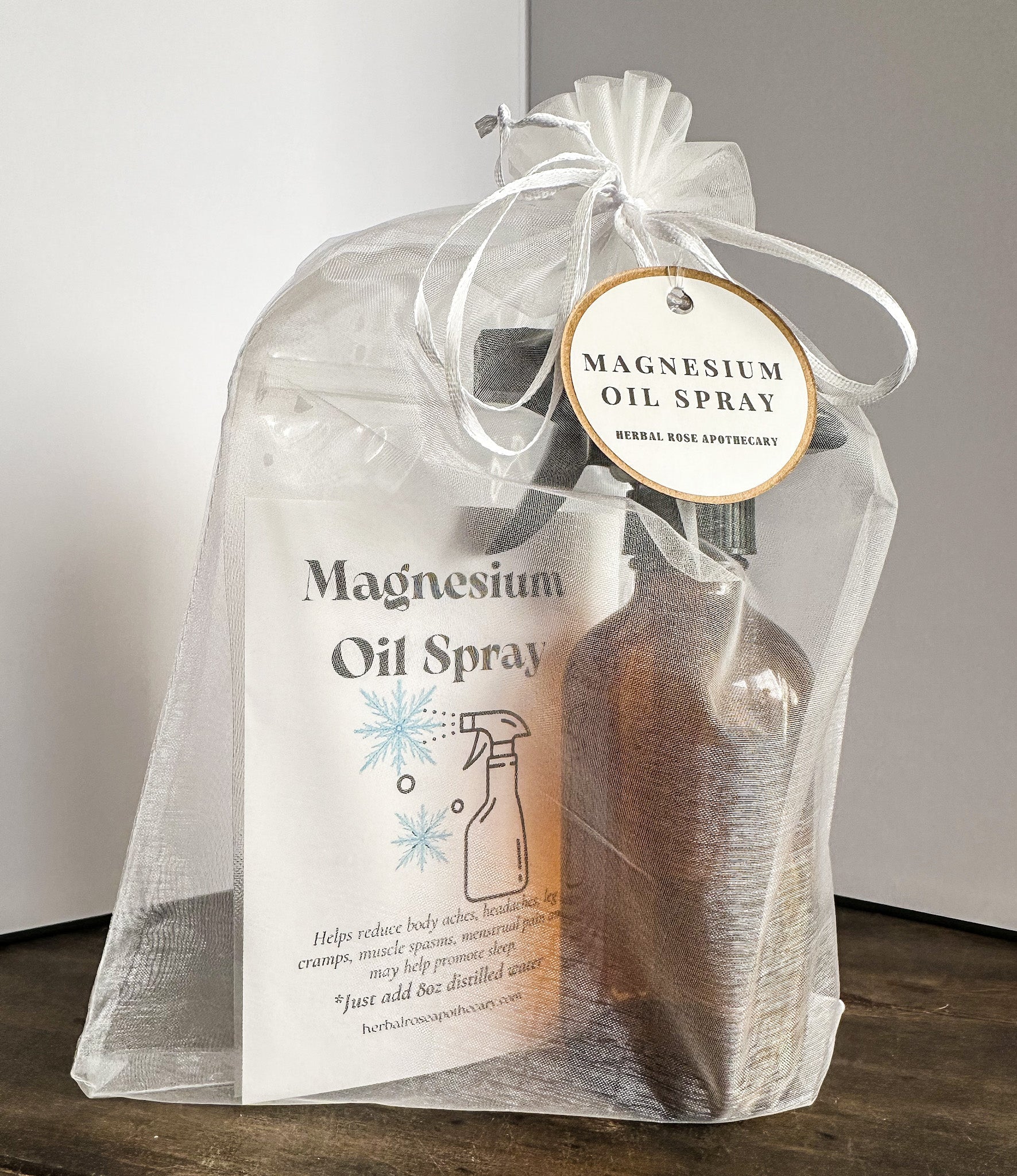 DIY Magnesium Oil Spray from herbalroseapothecary apothecary kit, featuring a clear spray bottle with magnesium oil for topical use.