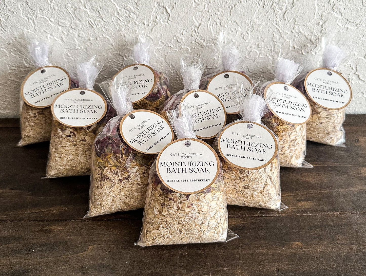 Herbalroseapothecary sore muscle herbal bath soak with Epsom salt, peppermint, and dried roses in a glass jar.