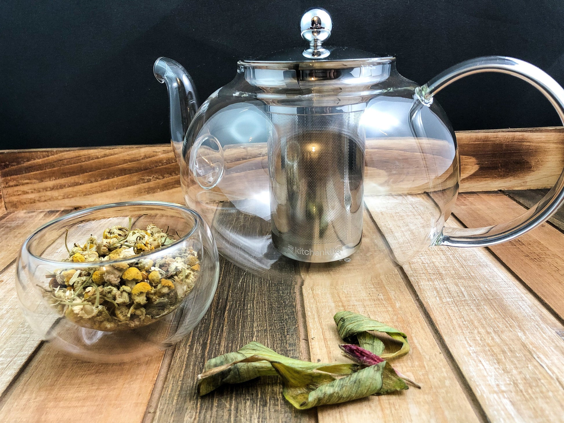 Dried organic chamomile herbs in an 8g package from HerbalRoseApothecary, showing yellow chamomile flowers and dried stems.