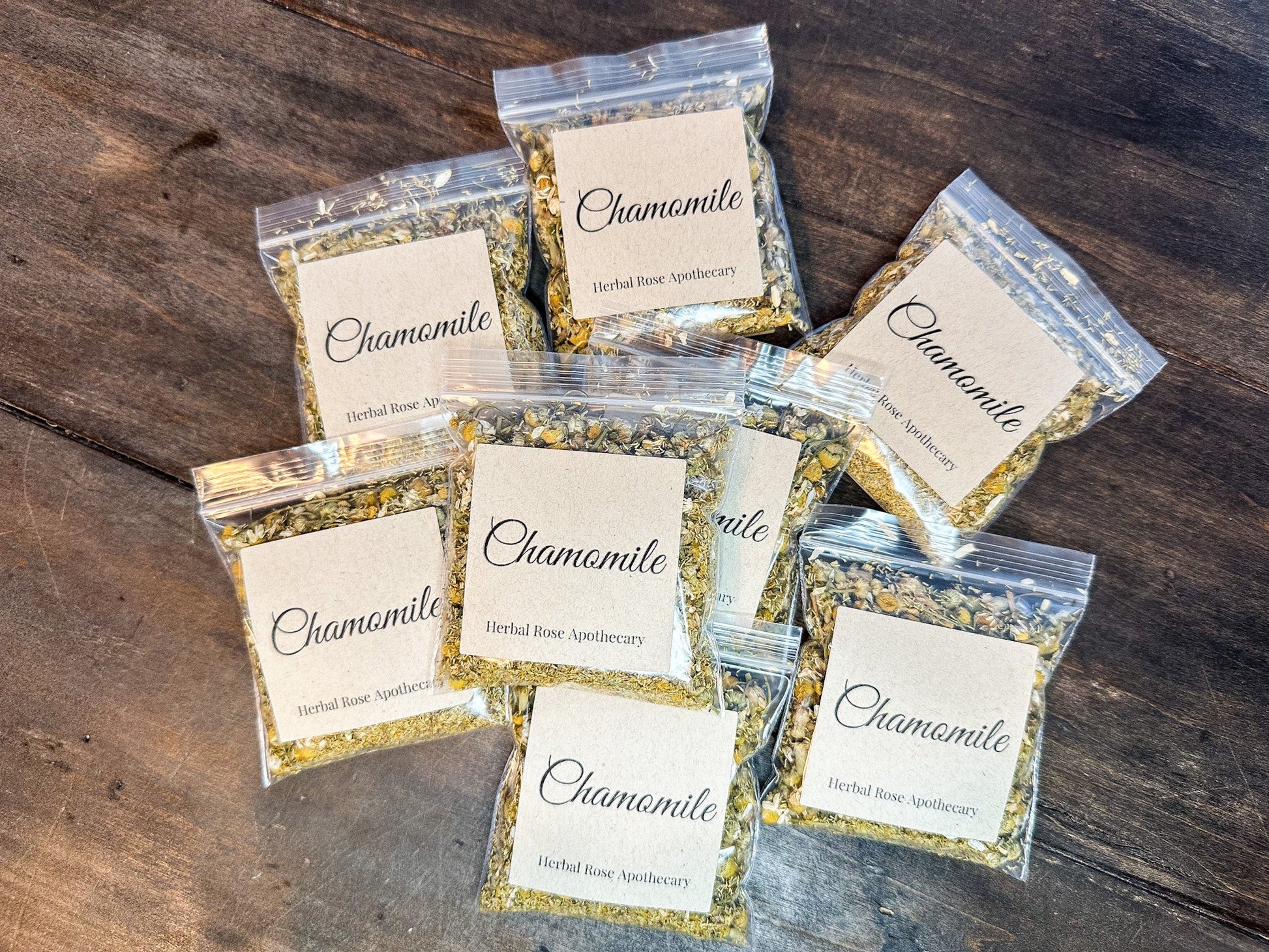 Dried organic chamomile herbs from HerbalRoseApothecary in an 8g package, showing fragrant dried yellow chamomile flowers.