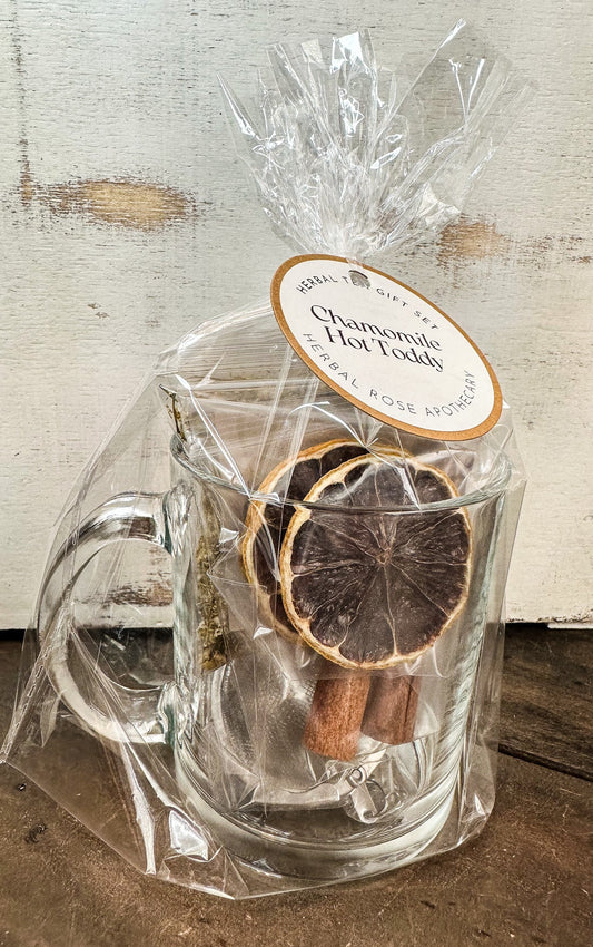 HerbalRoseApothecary Chamomile Hot Toddy gift set with mint, featuring herbal teas and accessories in a cozy, elegant package.