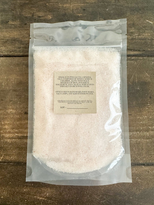 Himalayan Pink Salt from Herbal Rose Apothecary showing the textured pink salt crystals in a close-up view.