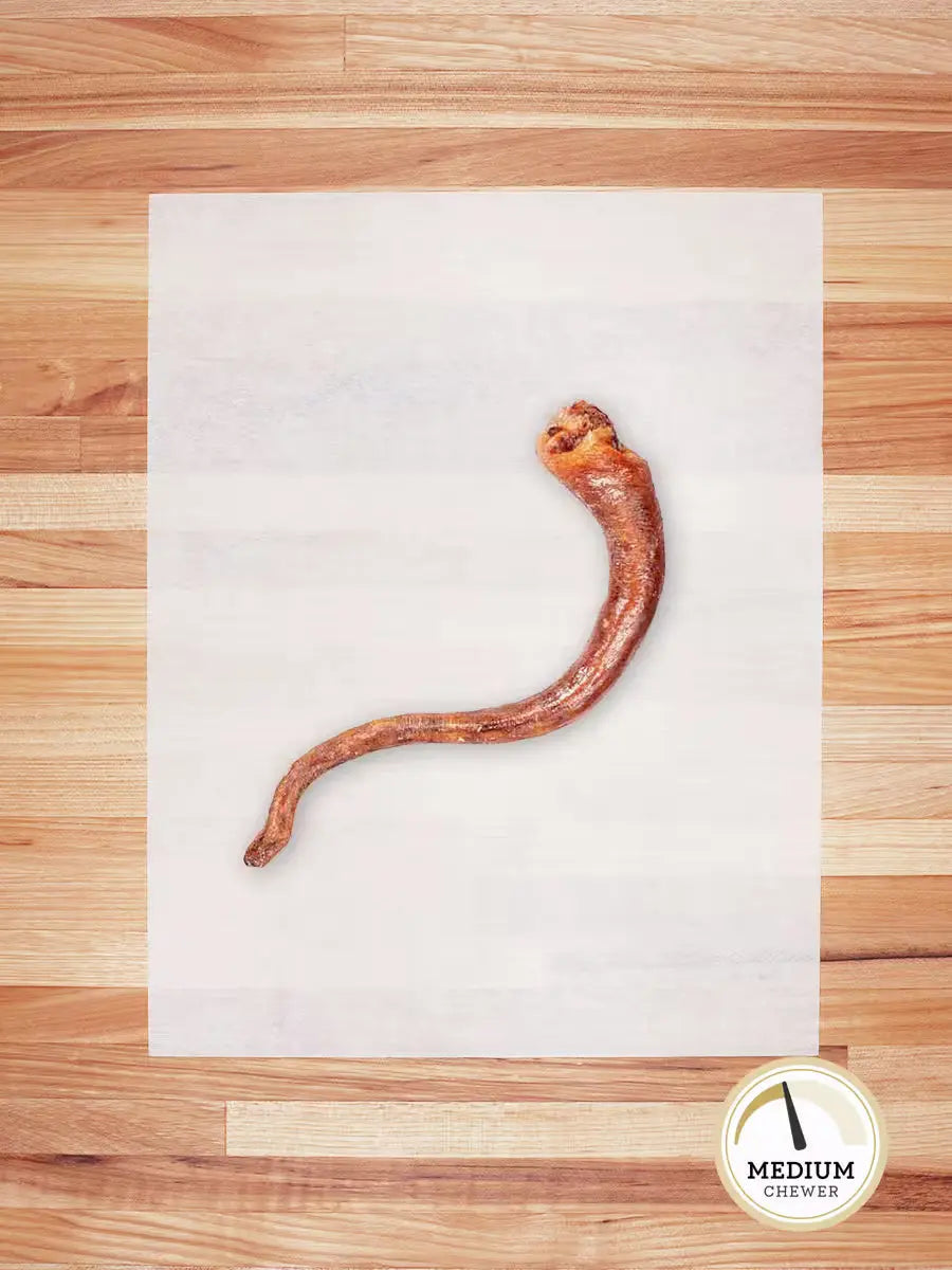 Farm Hounds hog tail chew showing a natural, twisted hog tail chew for dogs, highlighting its rustic, rawhide-like appearance.