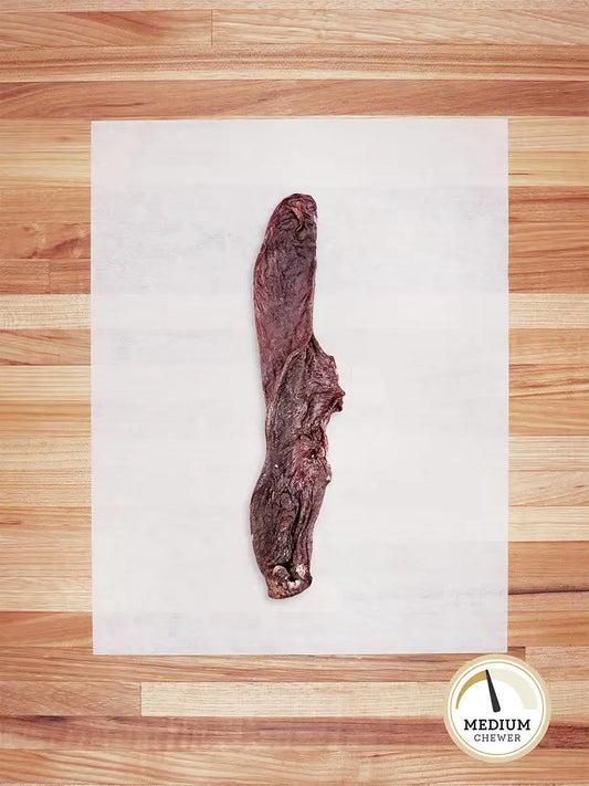 Farm Hounds hog tongue chew, natural dog treat made from dried hog tongue with textured surface for chewing.