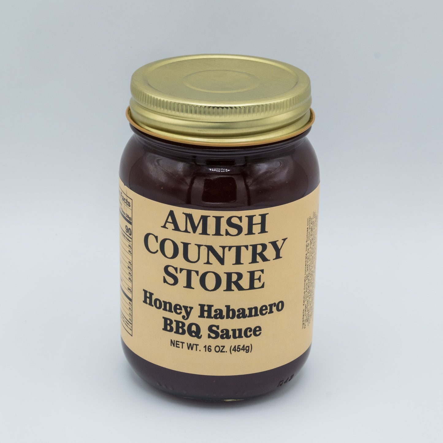 Canned Honey Habanero BBQ Sauce in 16 oz jar from Amish Country Store, featuring a golden honey and spicy habanero blend.