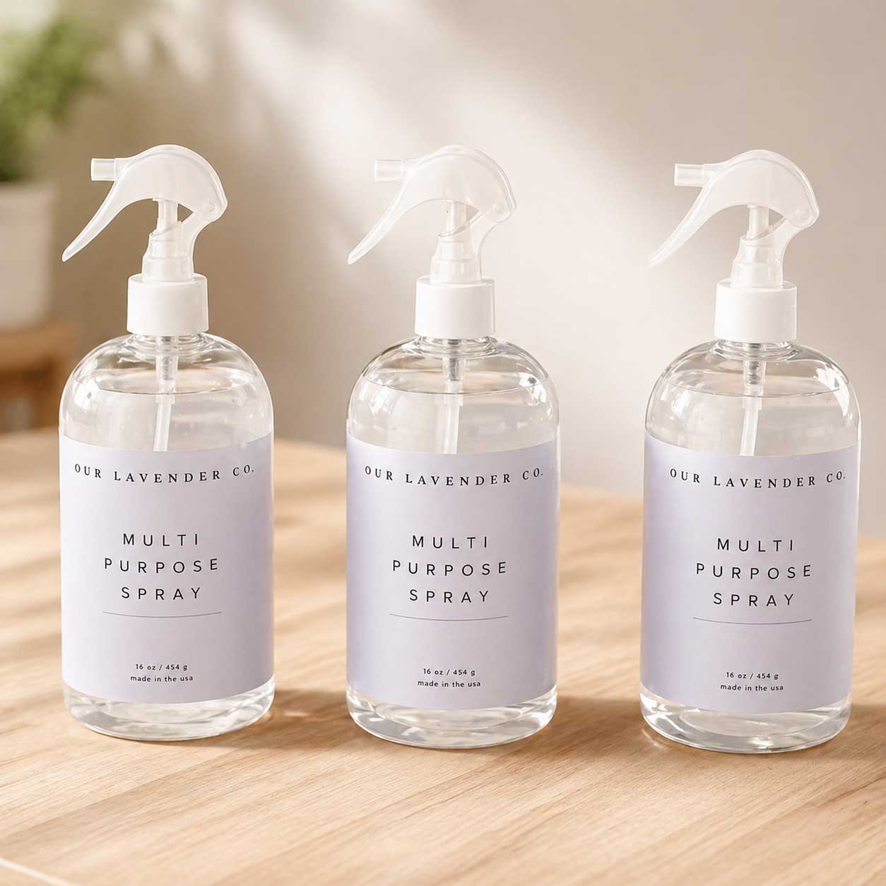 Lavender multipurpose cleaning spray bottle from Our Lavender Co, displayed in multiple sizes for home and garden use.
