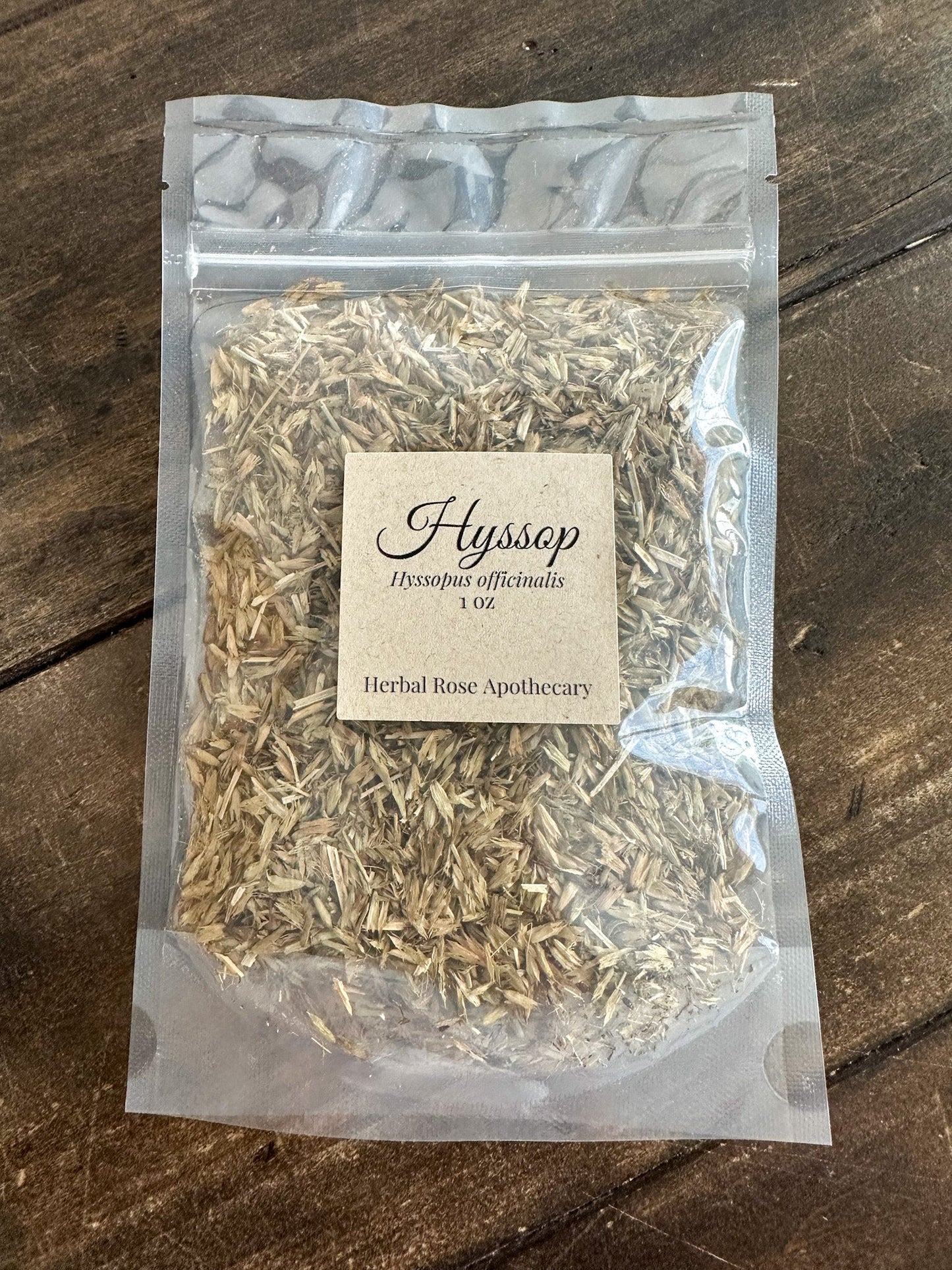 Dried hyssop herb in a 1oz package from Herbal Rose Apothecary, showing fresh green leaves and dried herb texture.