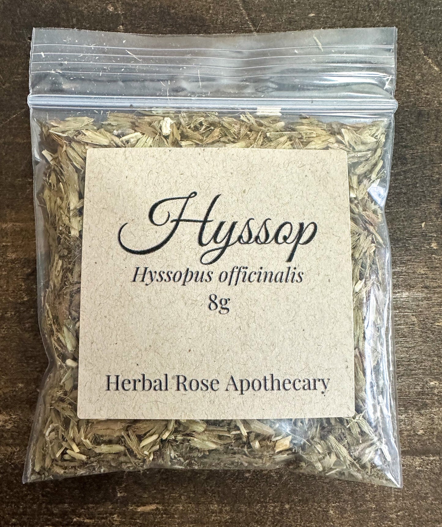 Dried hyssop herbs in an 8g package from HerbalRoseApothecary, showcasing fresh green leaves and delicate stems.