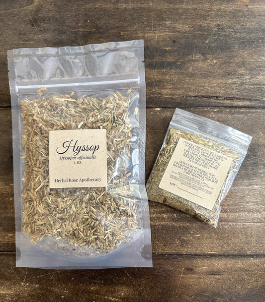 Dried hyssop herbs from HerbalRoseApothecary, showing leafy sprigs with small green leaves and purple flowers for herbal tea or remedies.