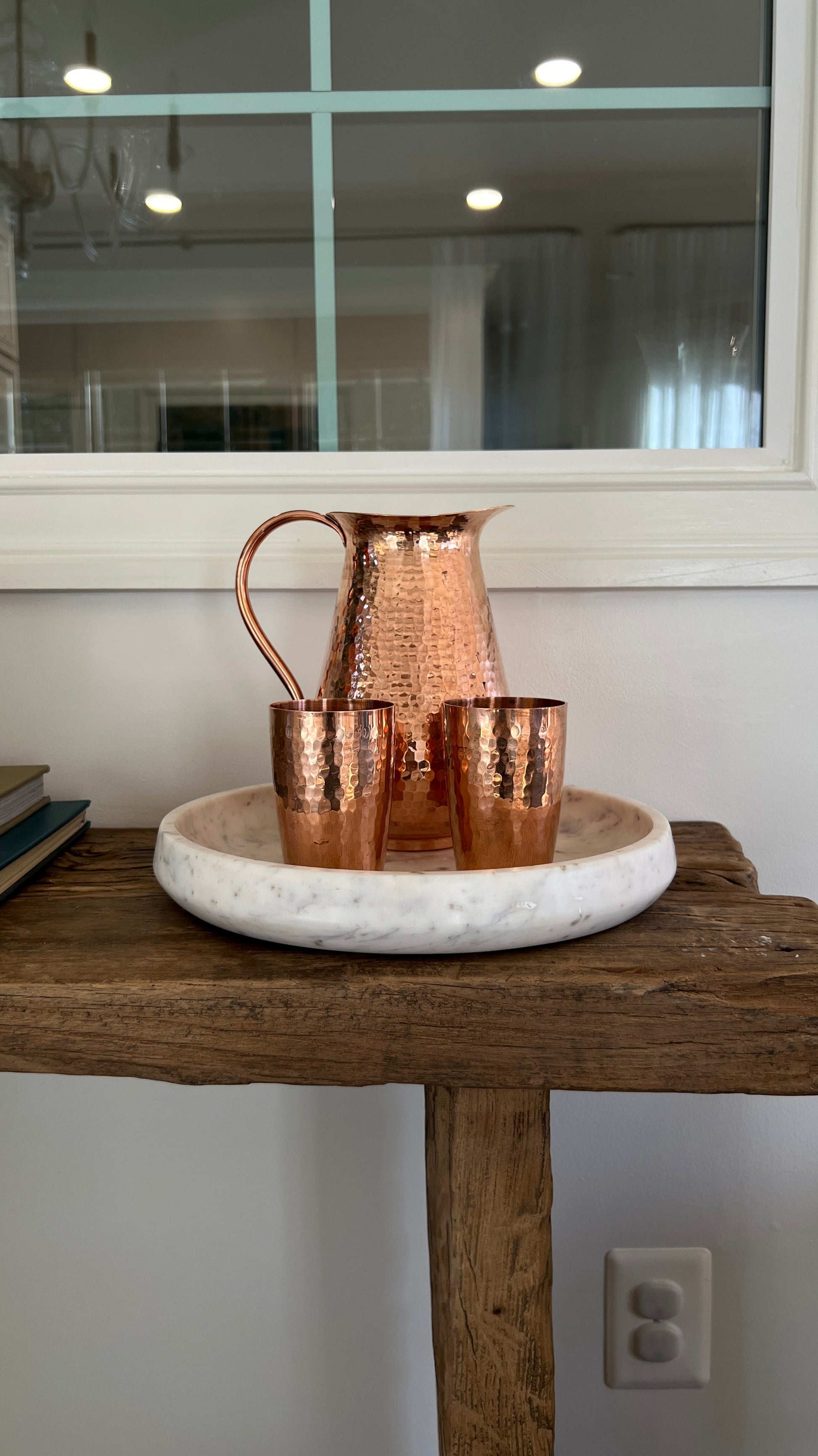 Sertodo Bisotun copper water pitcher with matching cups, handcrafted and polished for a traditional, elegant look.